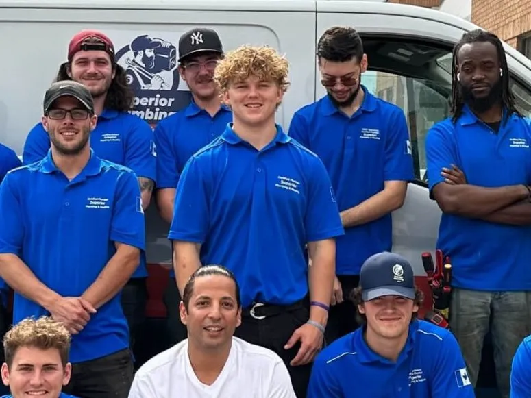 The Superior Plumbing & Heating team in front of their vans