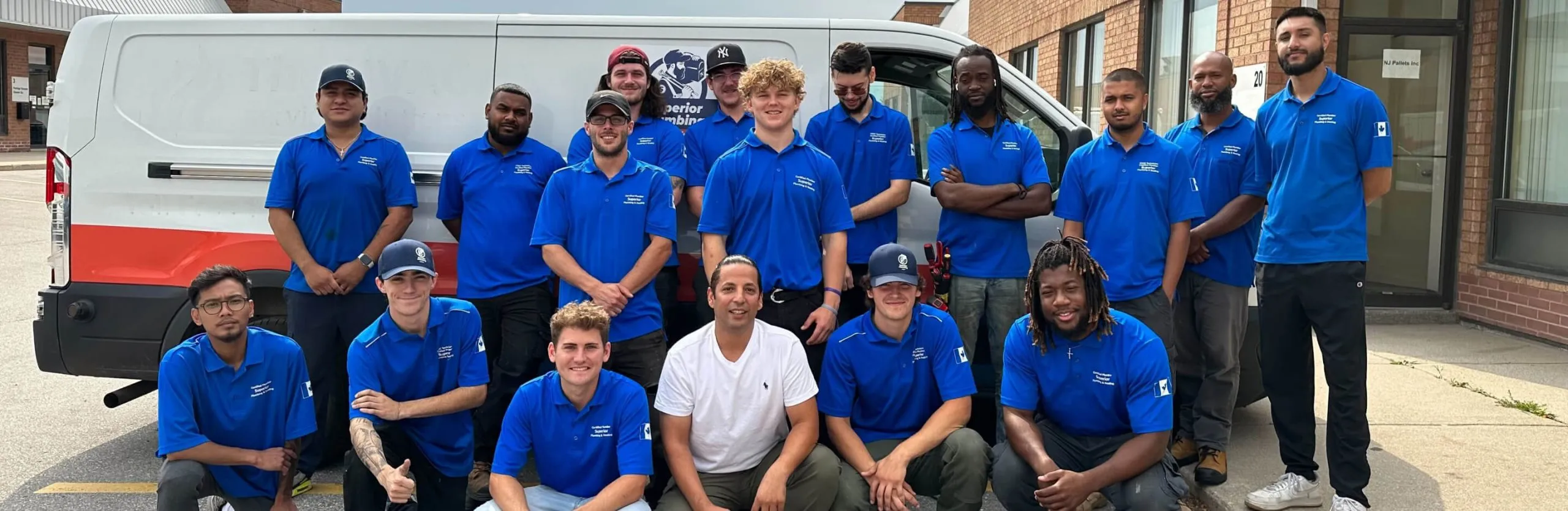The Superior Plumbing & Heating team in front of a company van